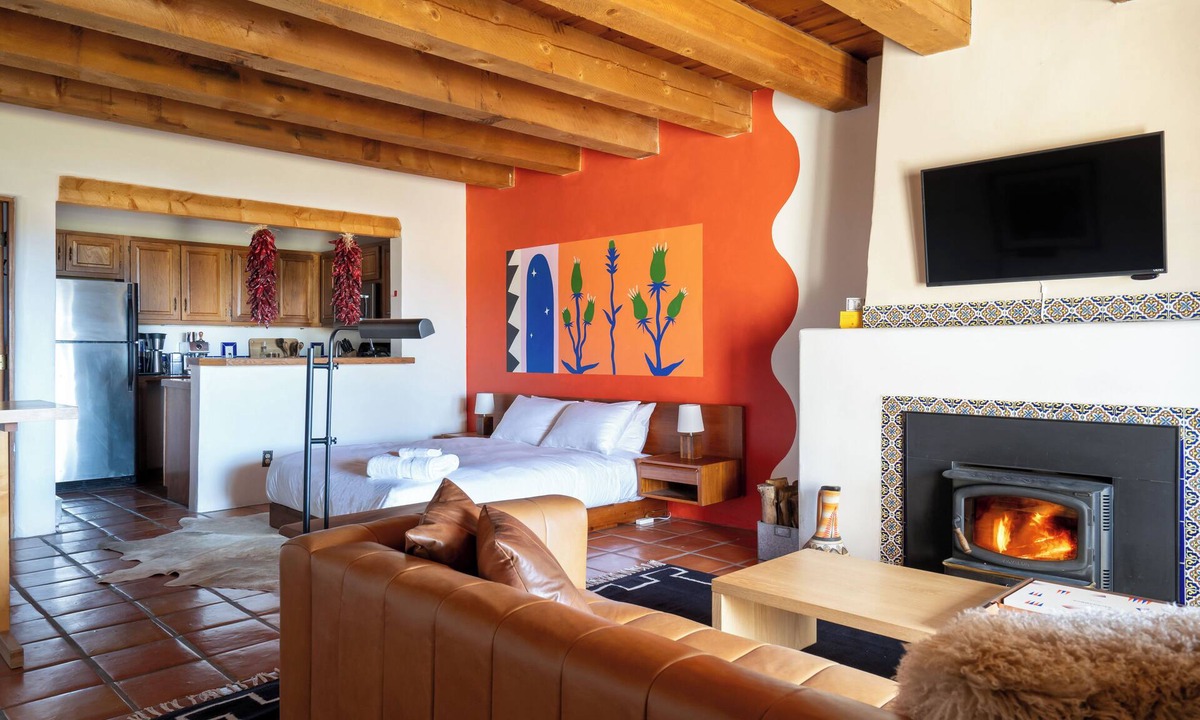 Arroyo Seco Apartment | Queen adobe studio with full kitchen, in-unit washer/dryer & fireplace. Private balcony + valley views. 15 min to Taos Ski Valley · 5 to Arroyo Seco. Sleeps 2.