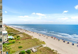 Oceanfront family-sized condo rental with lazy river, pool, and fitness center near Ocean Drive