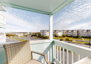 Second-Floor Condo with Ocean View, Easy Beach Access & Shared Pool/Grills