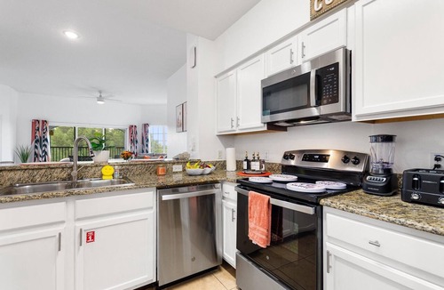Florida Central Atlantic Coast Condo | Boutique Luxury Condo Private Balcony Lake Views Near Disney