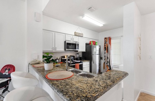 Florida Central Atlantic Coast Condo | Boutique Luxury Condo Private Balcony Lake Views Near Disney