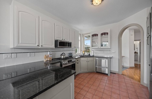 Colington Harbour House | Canal-Front OBX Home w/Dock + Hot Tub/Kayaks/Paddleboards + Bring Your Boat!