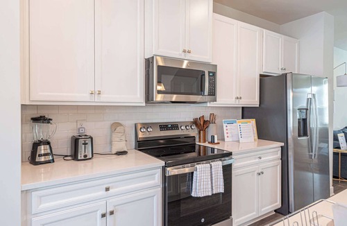 Bayside House | Coastal Townhome with 2 Pools & Gym