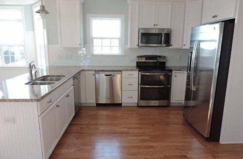 Holden Beach House | Experience seaside charm at "Welcome Home" in Holden Beach, a spacious 4BR retreat!