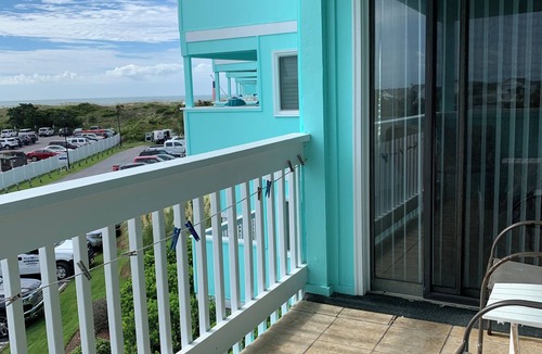 Morehead City Condo | Ocean-side condominium with pool. Fully-equipped for relaxed vacationing.