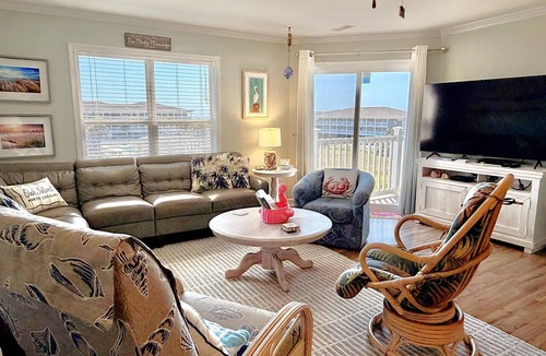 Tranquil Harbour Condo | OW 3201-Flirty Flamingo: Oceanview condo in Oak Island, sleeps 10, pet-friendly.
