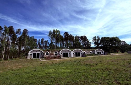 Littleton Cabin | Peaceful Hobbit Hideaway with Stocked Pond, Goats & Fire Pits near Littleton, NC