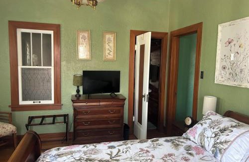 Silver Hill Apartment | Private Gated Garden Suite in Historic Home, walk to UNM Football and Basketball, UNM and Pres Hospitals