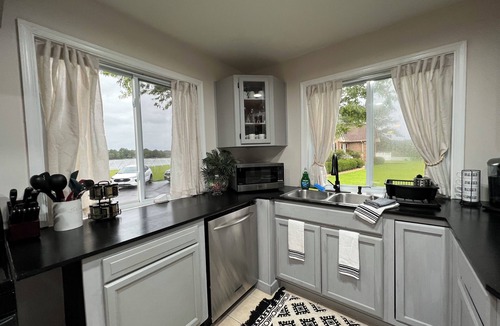 Achilles House | Waterfront Home with stunning views & Hot tub- rent Golf Cart/Kayak/Boat
