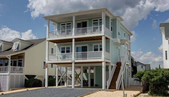 Experience seaside charm at "Welcome Home" in Holden Beach, a spacious 4BR retreat!