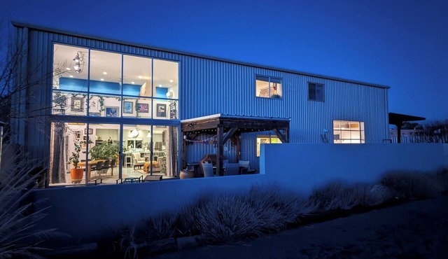 Light-filled main house close to town; views, hiking on high desert behind house