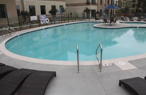 Bressi Ranch Condo | Accessible King Suite Near the Airport | Free Breakfast, Gym + Pool Access